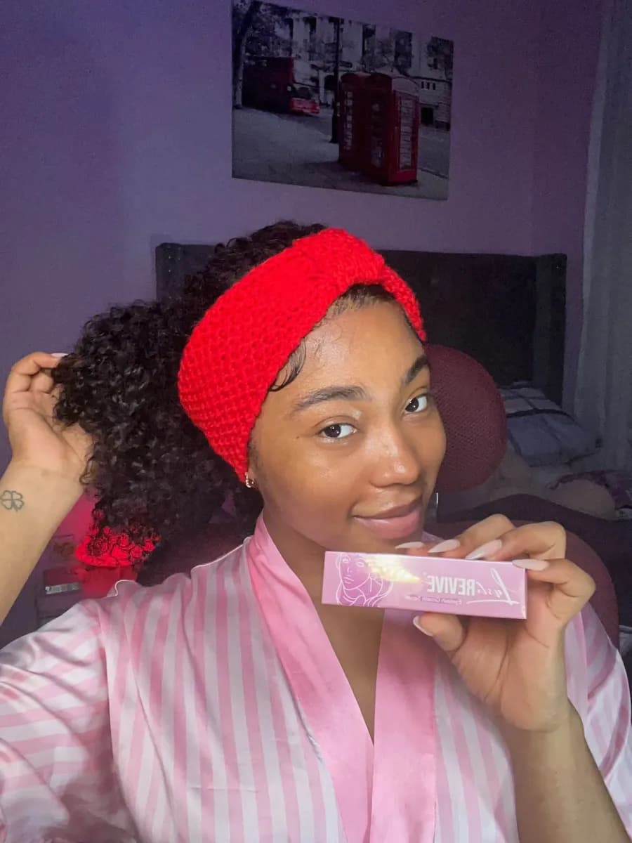 LashRevive customer with product box